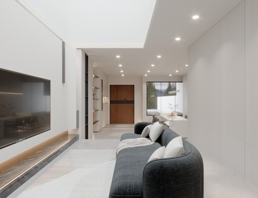 Living room with a dark sofa, TV wall and a view through to the entrance