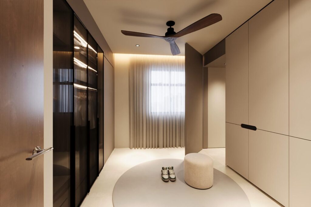 Dressing room with a glass-front wardrobe, cream cabinets and a round rug with a stool